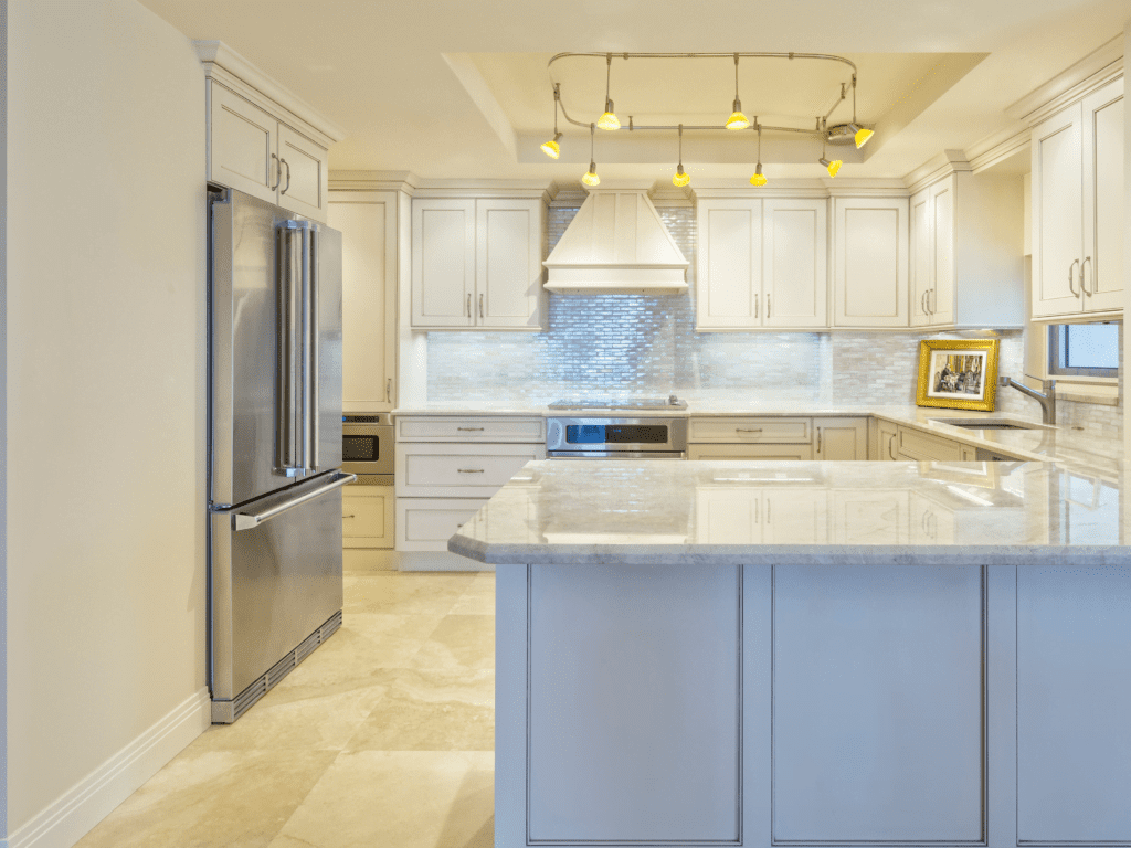 Bright and airy NEPA kitchen remodeling renovation with sky-blue cabinets, quartz countertops, and a subway tile backsplash, reflecting natural light.