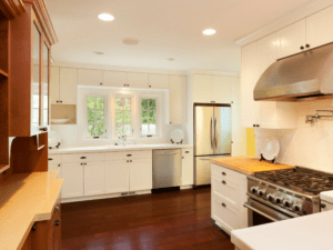 Contemporary kitchen in Scranton open shelving, subway tile backsplash, and stainless steel appliances