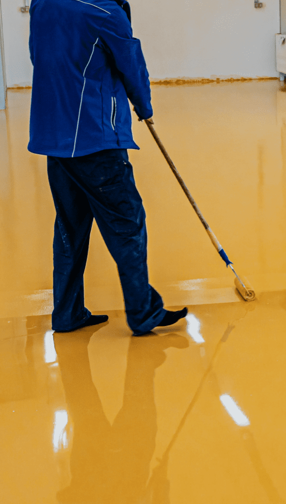 Skilled RNS Construction painters in action, meticulously applying vibrant paint on a commercial building's interior in Wilkes-Barre.