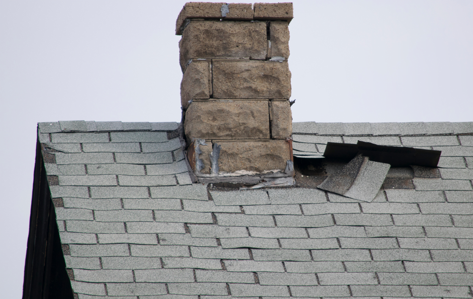Roofing Repairs in NEPA 2 - rnsexteriors.com Home in NEPA showing urgent roof repair needs with visible signs of shingle damage.
