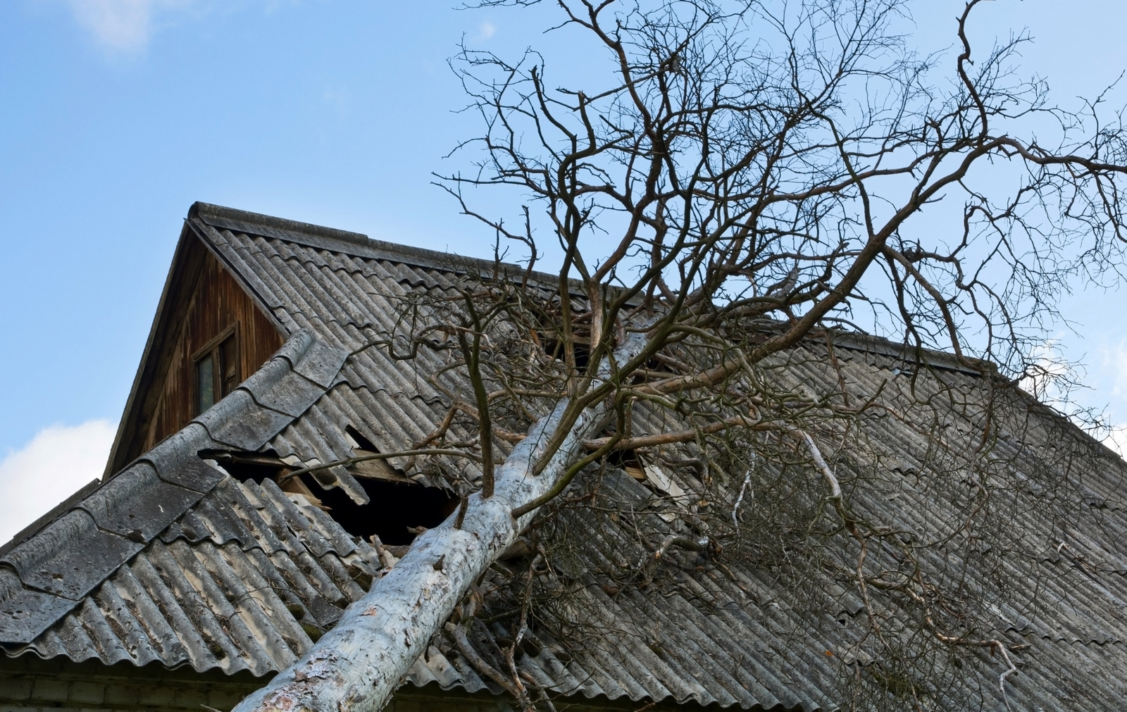 Roofing Repairs in NEPA 3 - rnsexteriors.com Home in NEPA showing urgent roof repair needs with visible signs of storm damage.