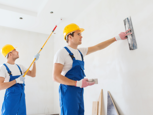 Skilled RNS Construction painters in action, meticulously applying vibrant paint on a commercial building's interior in Wilkes-Barre.